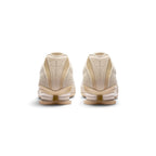 View from Behind Looking at the Rear: Rear-facing perspective focusing on the structured synthetic heel panels with embossed "NIKE SHOX" lettering and the dual Shox mechanical columns.   
