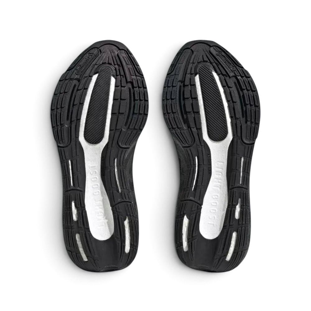 View of the rubber outsole, showcasing the stretchweb pattern designed to flex with the foot and provide grip on urban roads.