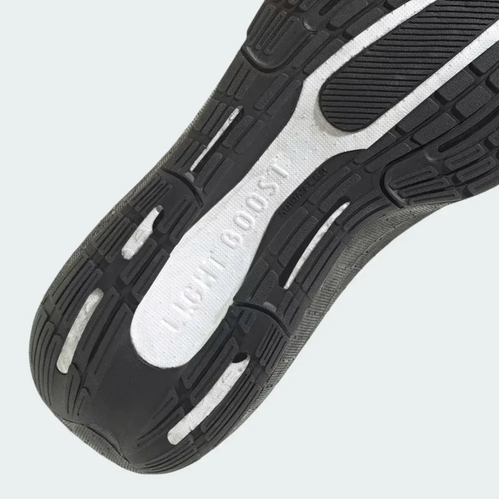 Detailed zoom on the Light BOOST foam, showcasing the pebbled texture of the cushioning and the precision bonding to the upper.