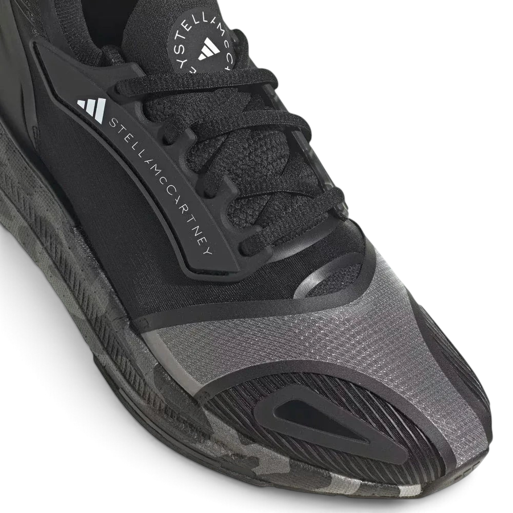 Close-up of the forefoot area, highlighting the breathable mesh texture and the premium lacing system.