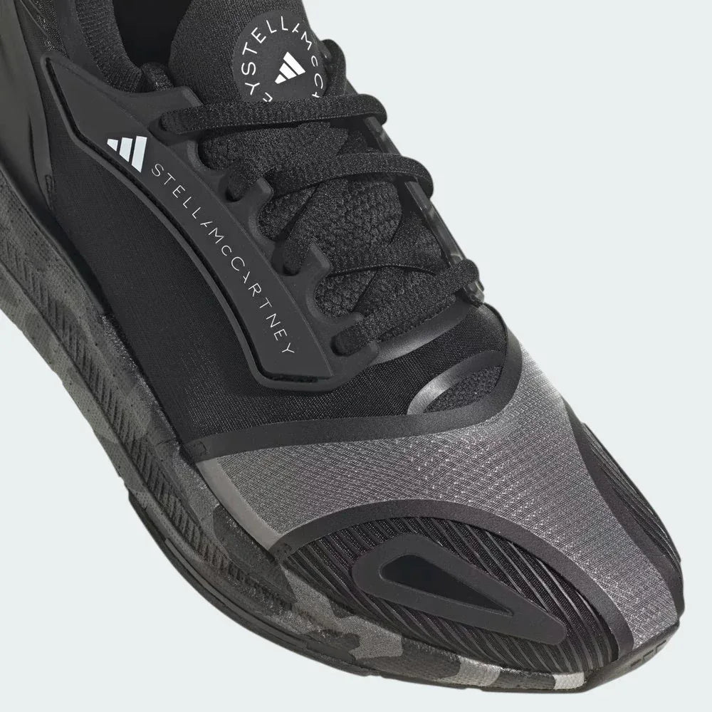Close-up of the forefoot area, highlighting the breathable mesh texture and the premium lacing system.