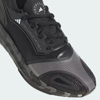 Close-up of the forefoot area, highlighting the breathable mesh texture and the premium lacing system.