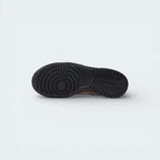 View of the black rubber outsole, showcasing the iconic hoops pivot circle and traction pattern designed for maximum grip.
