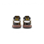 Rear view focusing on the Bright Citron heel tab with embroidered Nike branding and the clean white midsole.