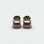 Rear view focusing on the Bright Citron heel tab with embroidered Nike branding and the clean white midsole.