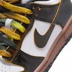 Close-up of the front, showing the quality of the white leather toe box and the secure black lacing system.