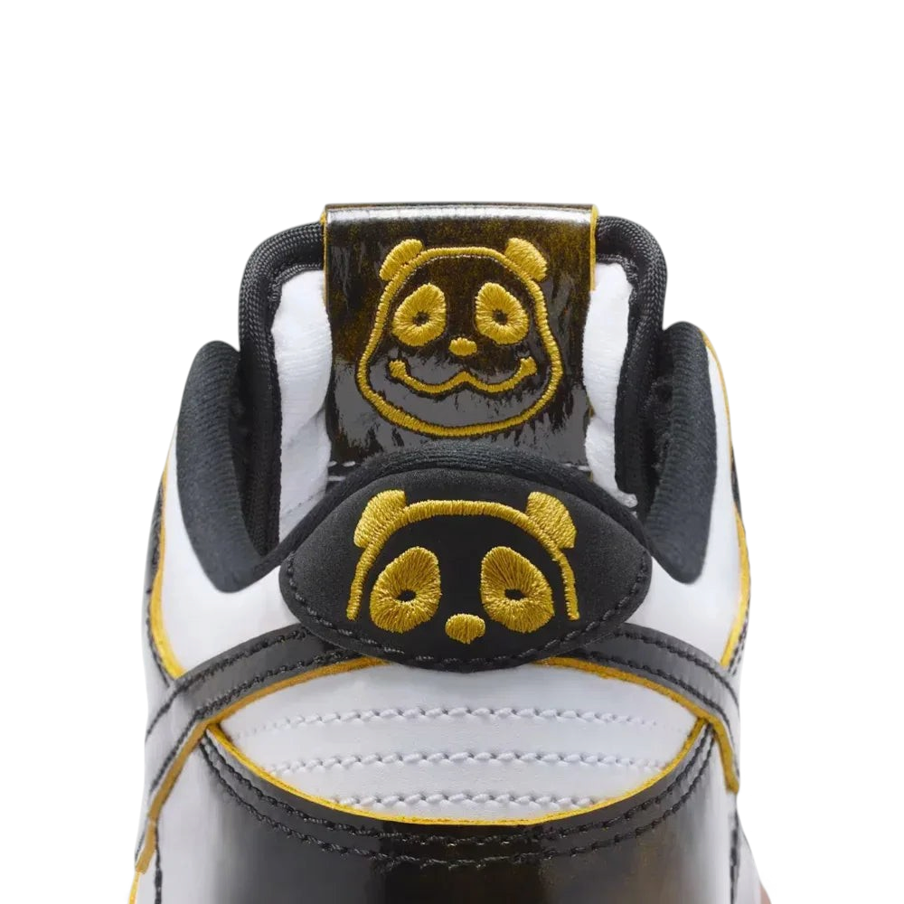 Close-up of a sneaker with panda face design on a white background