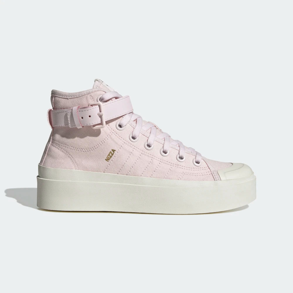 Highlights the high-velocity sweep of the platform midsole, showing the professional, clean texture of the Almost Pink canvas body, the tonal stitched 3-Stripes branding, and the unique zip accessory pocket attached cleanly to the ankle strap.