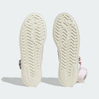 Displays the classic geometric vulcanized traction pattern of the solid off-white rubber sole, engineered for unreal everyday multi-surface street grip.