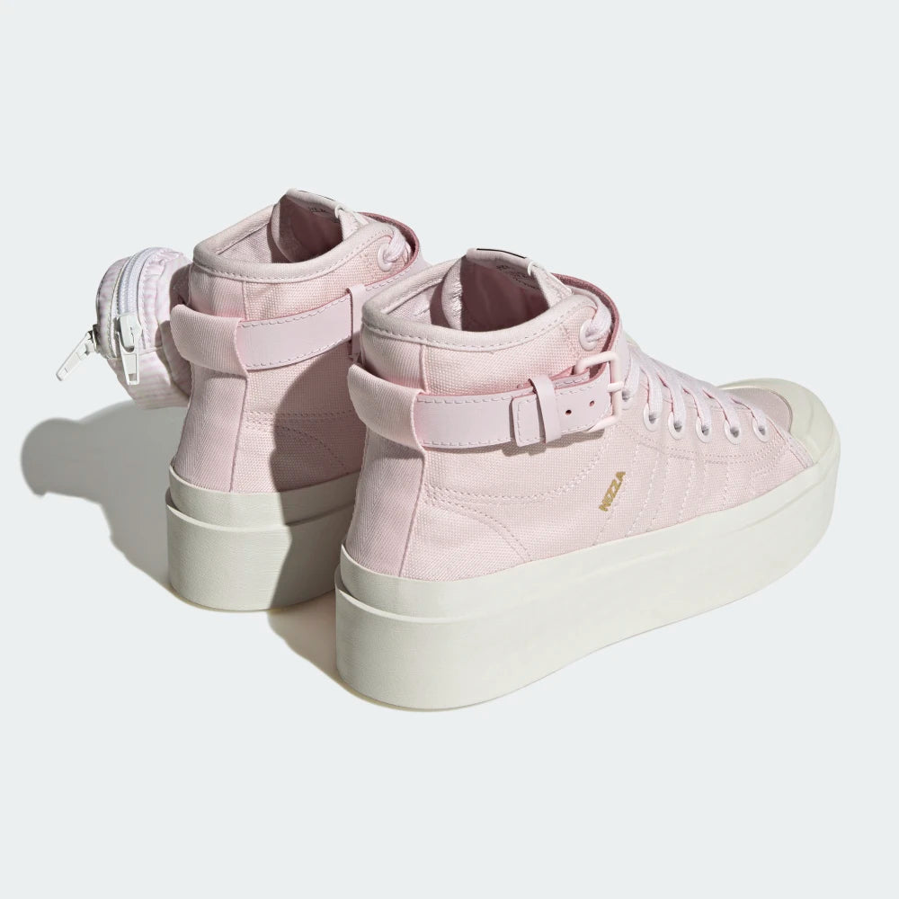 Focuses on the contoured shape of the high-top collar, highlighting the clean textile pull tab tracking down the rear spine above the signature adidas Originals rubber heel badge.