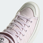 Highlights the "unreal" clean finish where the thick, layered platform vulcanized rubber midsole walls securely bond to the eco-conscious cotton upper framework.