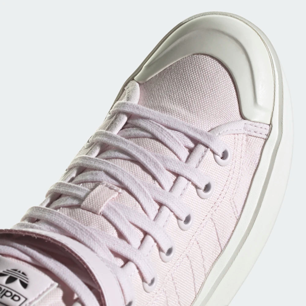Highlights the "unreal" clean finish where the thick, layered platform vulcanized rubber midsole walls securely bond to the eco-conscious cotton upper framework.
