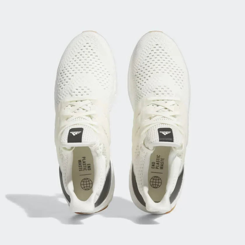 Top-down view of a pair of Adidas Ultraboost 1.0 Men's trainers in off-white, highlighting their seamless Primeknit construction and unique lacing.