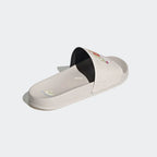Rear angled view Adidas Adilette Slides Unisex in pink, showcasing their sleek design and iconic branding.