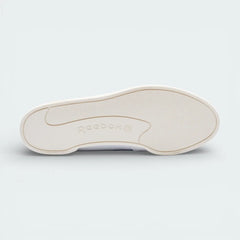 View of the durable rubber outsole, showcasing the iconic 80s court traction pattern in a tonal chalk finish.