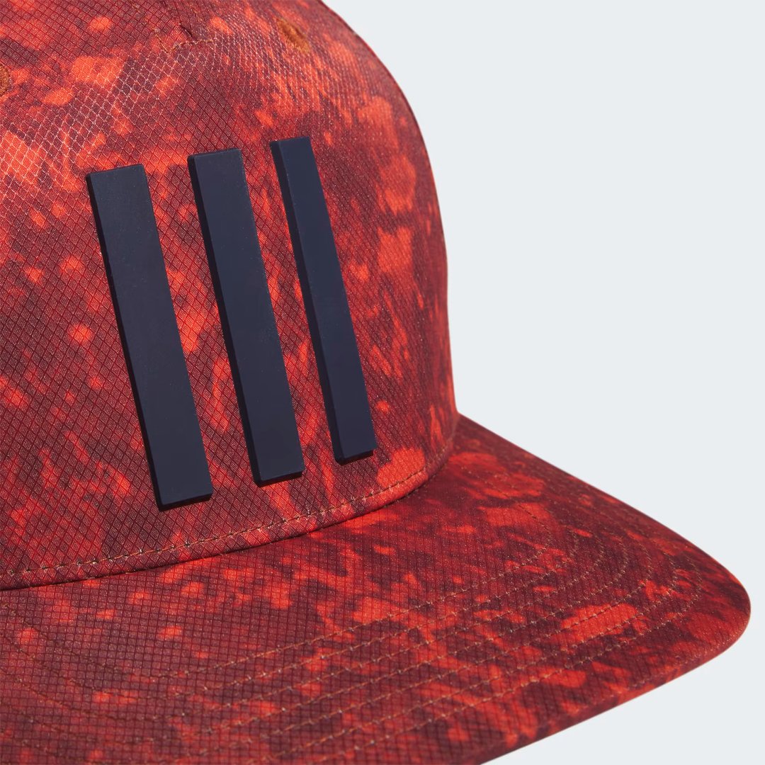 Close-up zoom on the fabric of the Adidas 3 Stripes Printed Tour Golf Cap, showing the lightweight jacquard texture and the detailed 3D silicone logo.