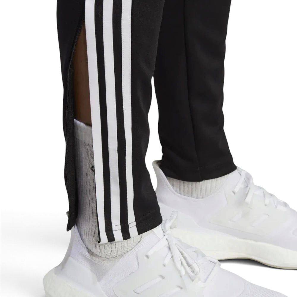 Detailed zoom on the ankle zip hardware and the hem, showcasing the precision construction for easy boot access.