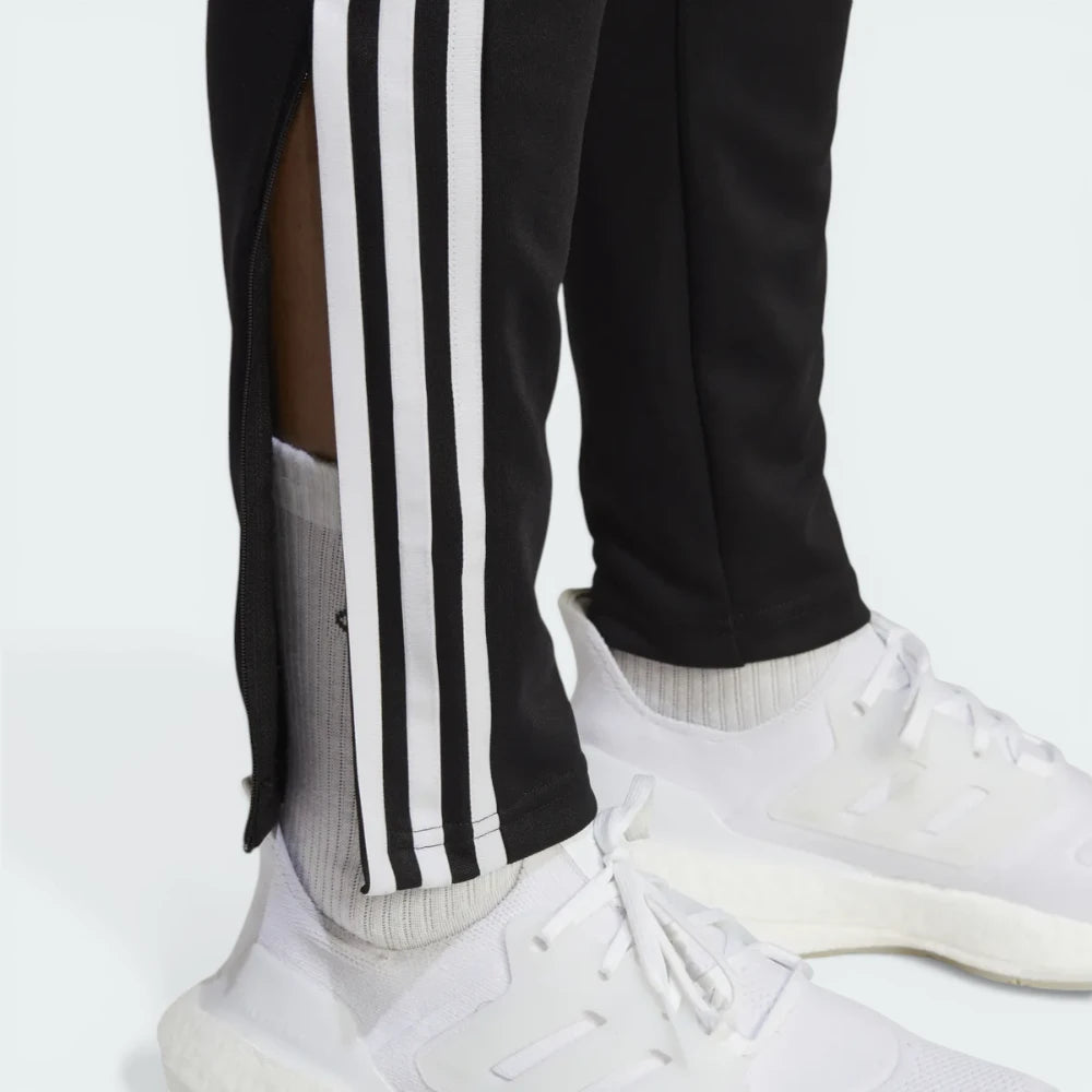 Detailed zoom on the ankle zip hardware and the hem, showcasing the precision construction for easy boot access.