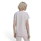 Shows the seamless, unprinted Almost Pink back panel, clean shoulder-to-shoulder taped seams, and the balanced drop of the straight hemline.