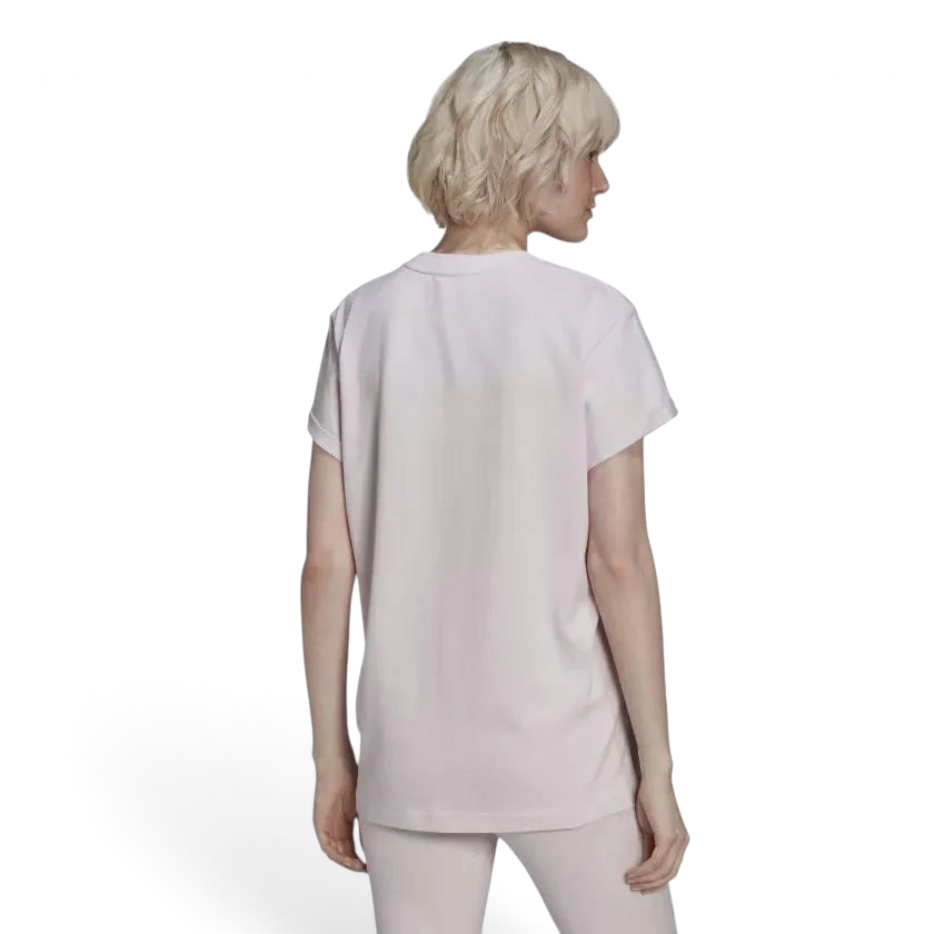 Shows the seamless, unprinted Almost Pink back panel, clean shoulder-to-shoulder taped seams, and the balanced drop of the straight hemline.