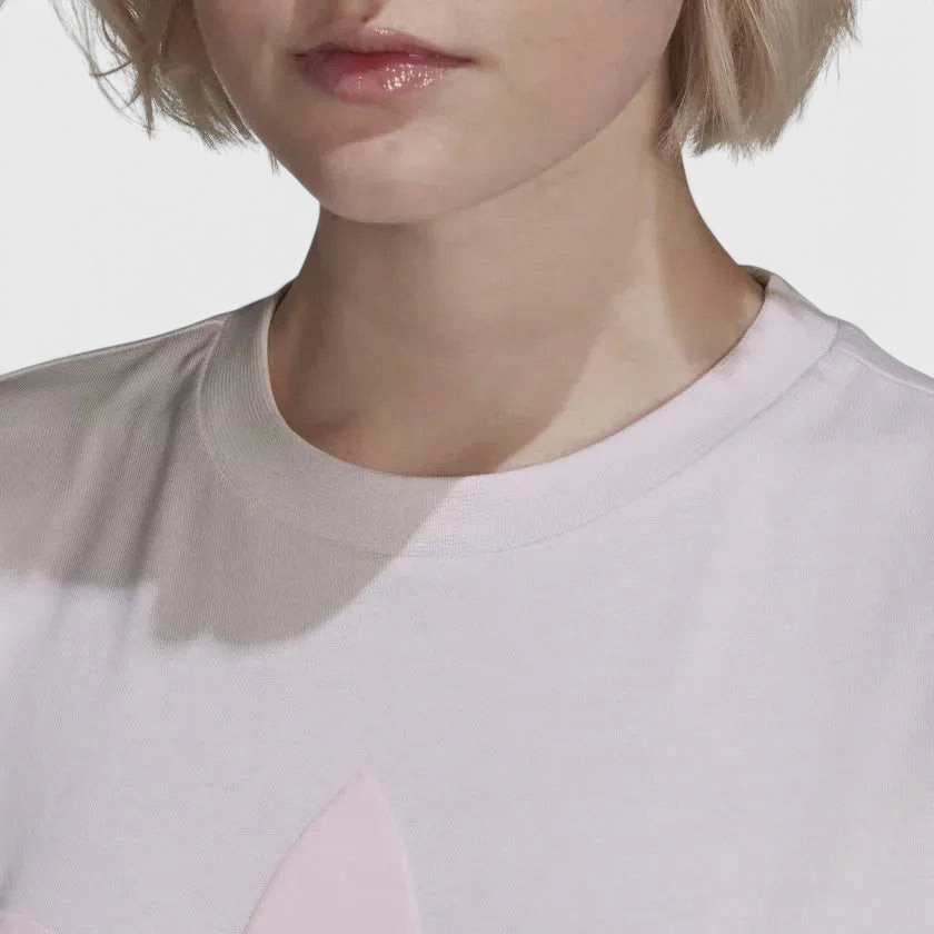 Details the micro-precision of the upper chest, showing the tight knit of the ribbed crewneck, the crisp screen-printed adidas Trefoil logo, and inner collar neck tape.