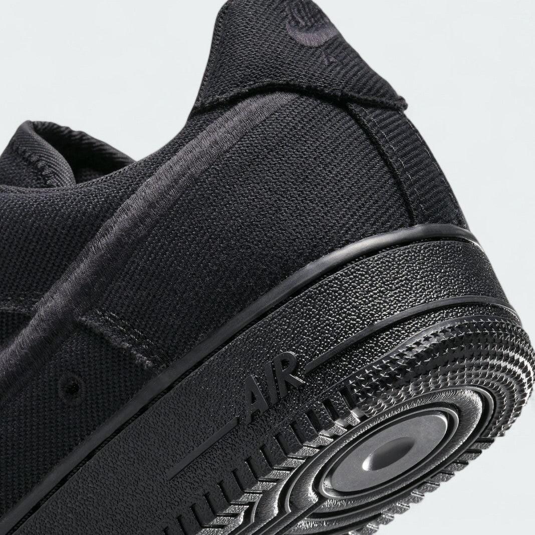 Detailed zoom on the outsole and midsole of the Nike Air Force 1 Low Canvas Men's trainers, highlighting the cushioned midsole and durable rubber outsole.