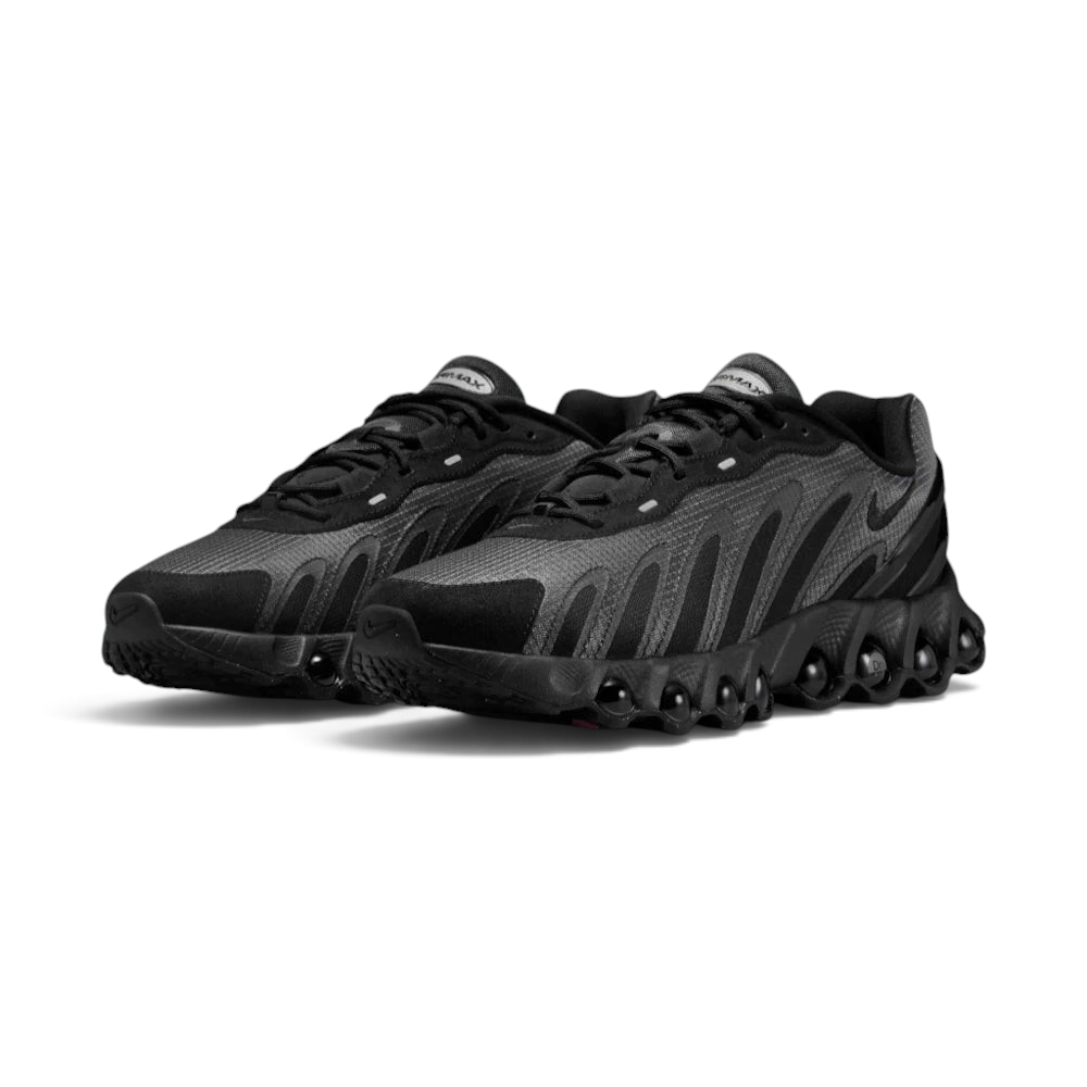 Focuses on the locked-in central lacing layout, displaying the symmetry of the black mesh tongues, dark laces, plush padded collars, and insoles printed with Air Max Dn logos.