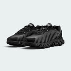 Focuses on the locked-in central lacing layout, displaying the symmetry of the black mesh tongues, dark laces, plush padded collars, and insoles printed with Air Max Dn logos.