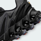 Details the micro-precision of the upper, showing the reinforced protective layer wrapping the toe tip, dark laces, and sleek tongue badge.