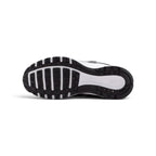 Full-length bottom profile showing the black rubber outsole, showcasing the modified Waffle traction lugs, forefoot flex grooves, and central midfoot stability channel.