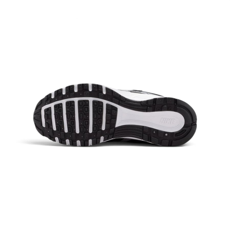 Full-length bottom profile showing the black rubber outsole, showcasing the modified Waffle traction lugs, forefoot flex grooves, and central midfoot stability channel.