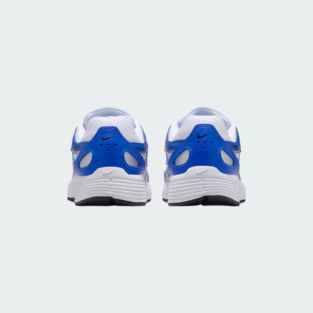 Rear view of the Nike P-6000 Juniors' blue trainers, focusing on the heel design, layered materials, and subtle branding.