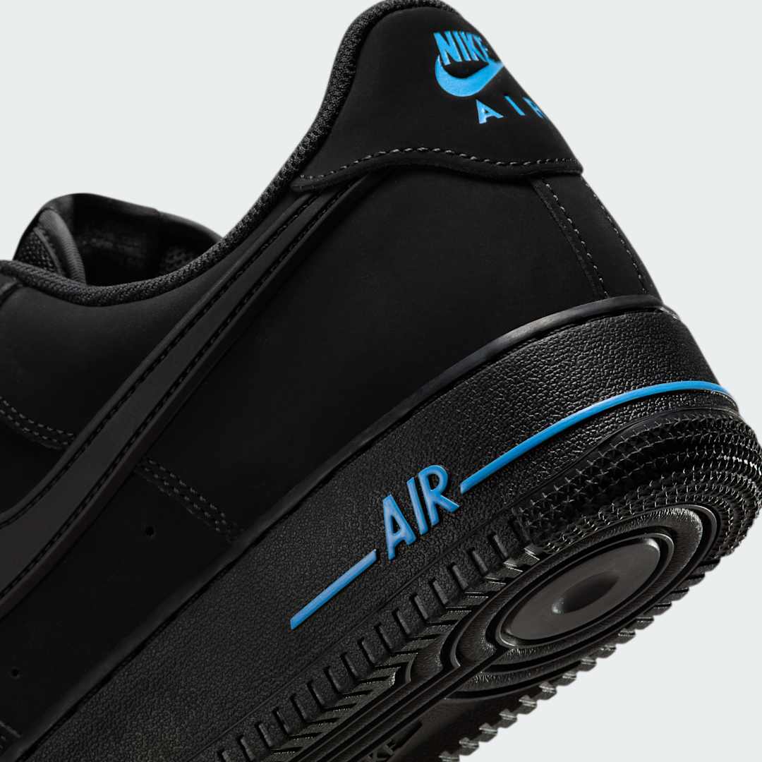 Detailed zoom on the outsole and midsole of the Nike Air Force 1 '07 Men's black trainers, highlighting the cushioned midsole and durable rubber outsole.