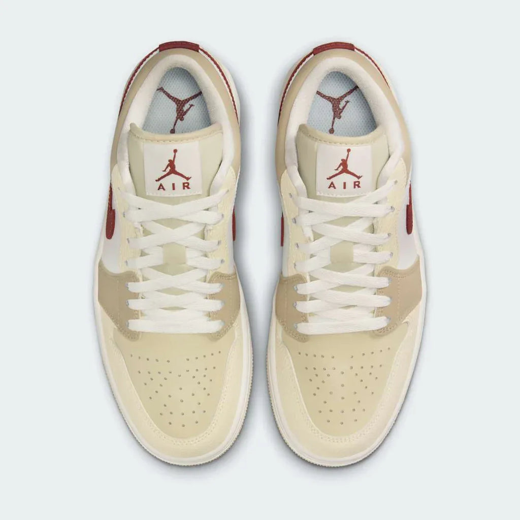 Air Jordan 1 Low White Leather Trainers HV6530-100 top view showing perforated toe box, flat laces, and padded tongue with Jumpman logo