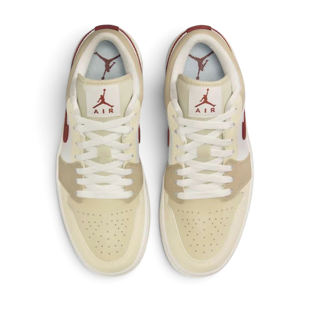 Air Jordan 1 Low White Leather Trainers HV6530-100 top view showing perforated toe box, flat laces, and padded tongue with Jumpman logo