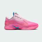 Nike LeBron XXII SN men's basketball trainer in pink foam/photo blue, side profile showing streamlined design, prominent Swoosh, and midfoot support wings.