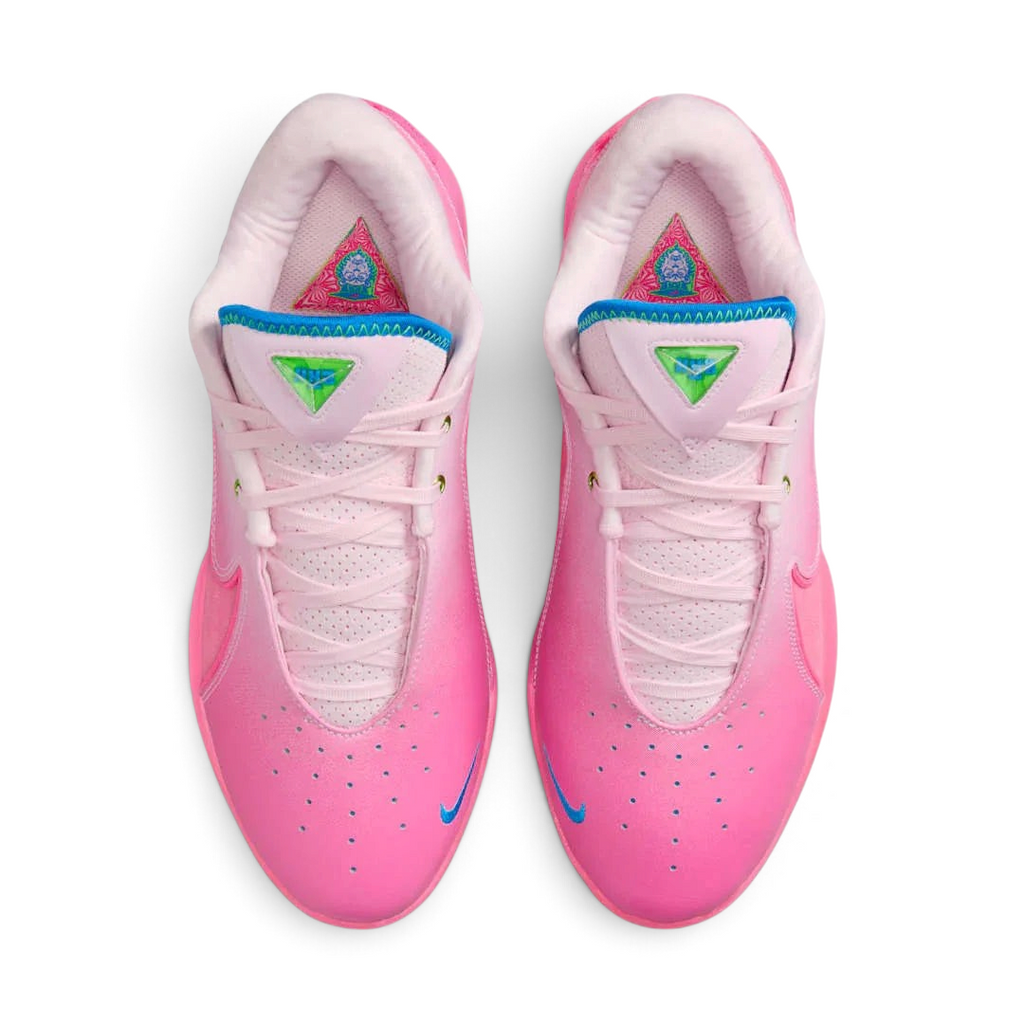 Top-down view of a pair of Nike LeBron XXII SN basketball trainers in vibrant pinks, highlighting the lacing system and textured upper.
