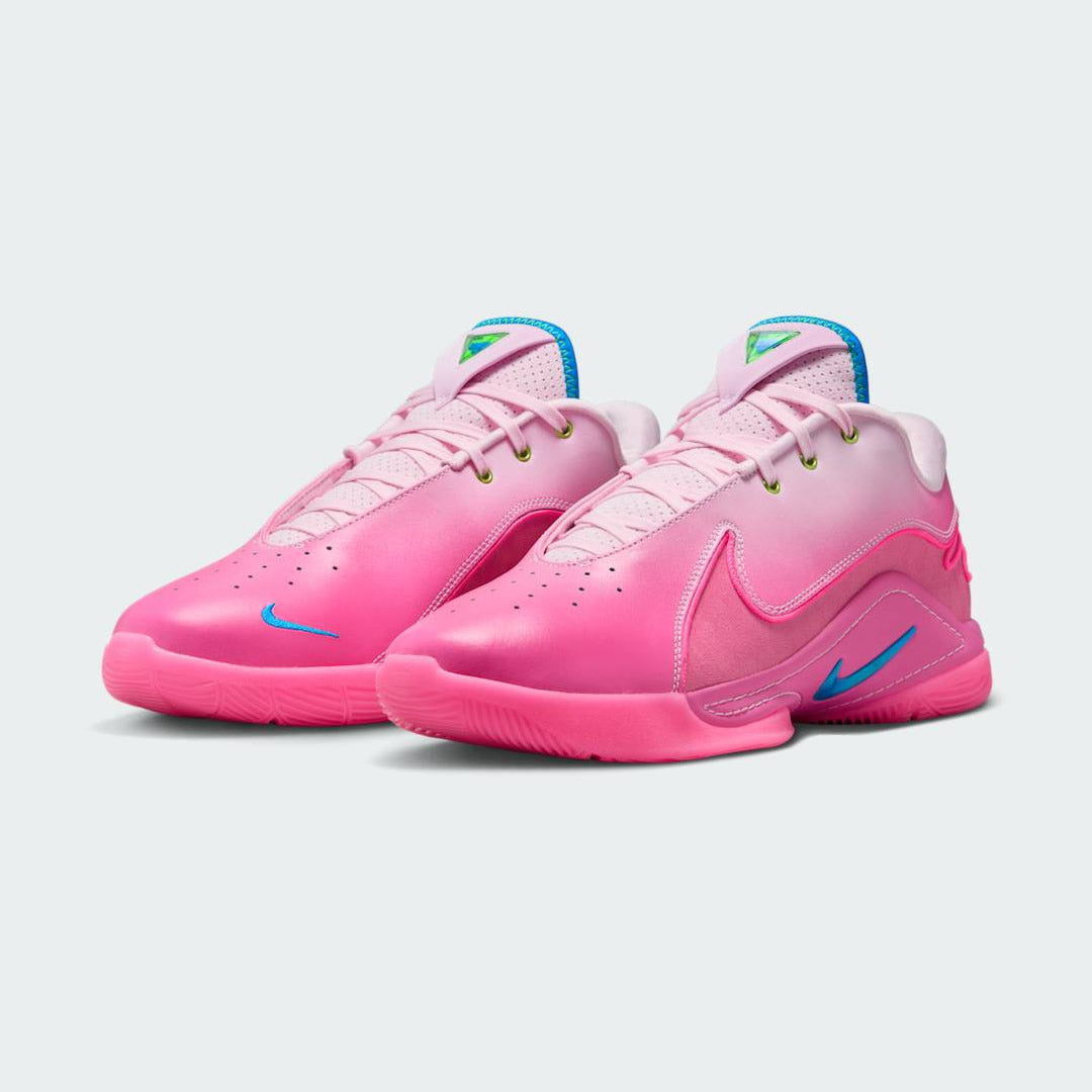 Angled view of two Nike LeBron XXII SN men's basketball trainers in "I Promise" pink colorway, side by side, showcasing their dynamic design.
