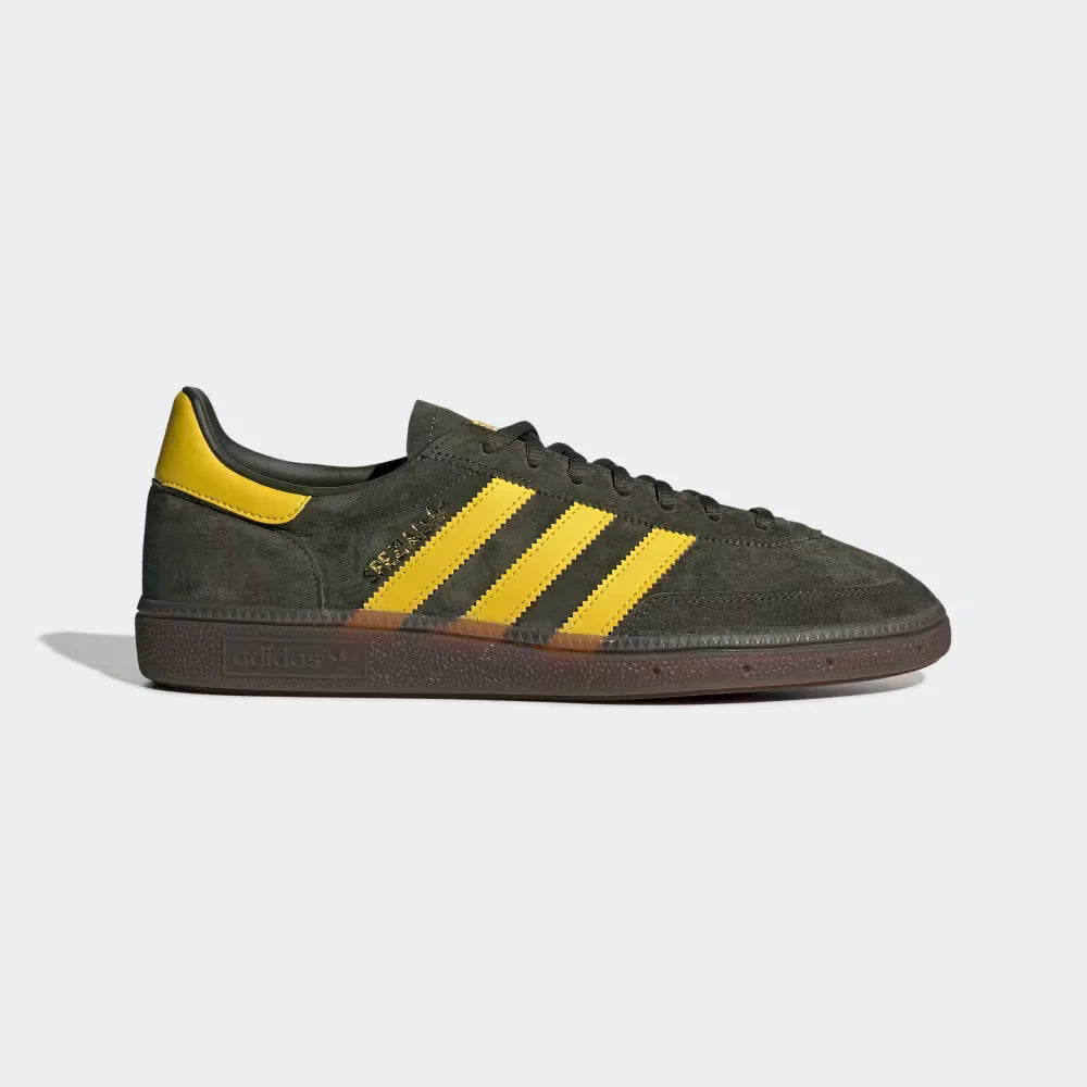 The Night Cargo Spezial, highlighting the Tribe Yellow 3-Stripes and the classic low-profile gum rubber sole.