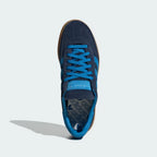 Looking down at the navy suede lacing system and the Bright Blue branding on the tongue.