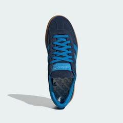 Looking down at the navy suede lacing system and the Bright Blue branding on the tongue.