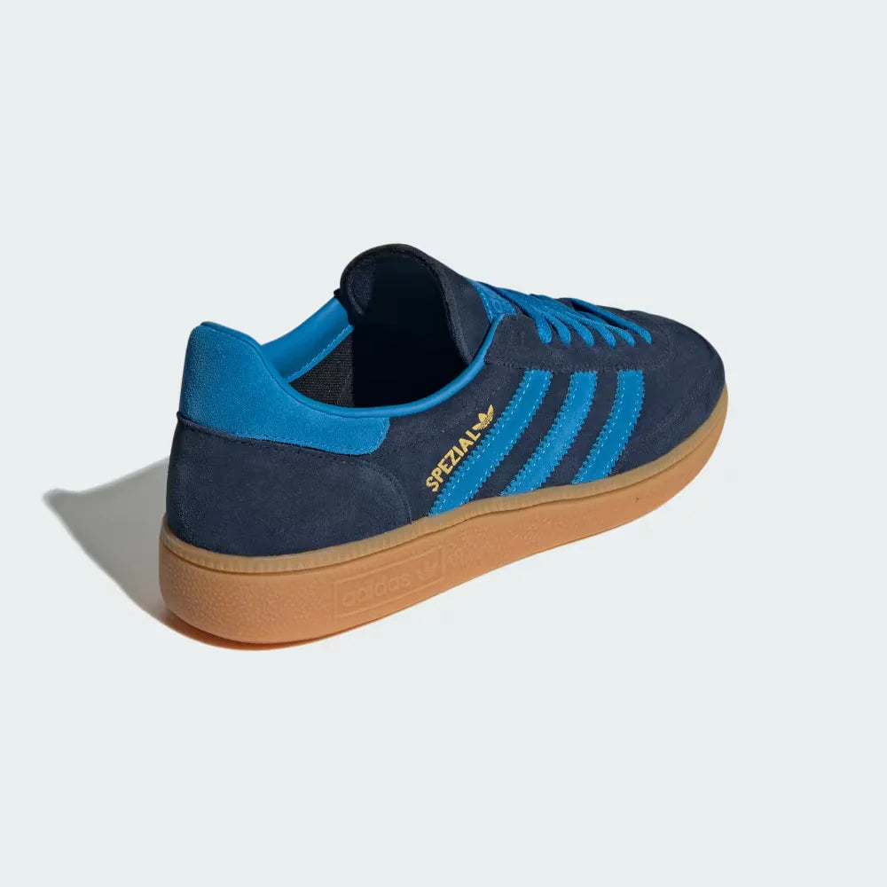 Focusing on the Bright Blue heel tab and the seamless transition into the gum outsole.