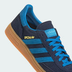 Highlighting the textured nature of the gum rubber and the gold foil "Spezial" lettering.