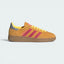 Highlights the high-velocity sweep of the Lucid Pink serrated 3-Stripes and the professional depth of the gleaming Silver Metallic Spezial branding.