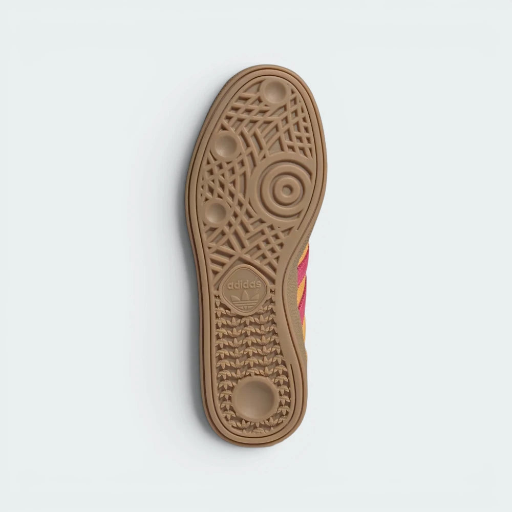 Displays the technical geometric traction grid of the indoor rubber outsole, engineered for unreal everyday street grip.