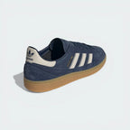 Focusing on the Bliss-colored heel tab and the clean transition into the rubber outsole.