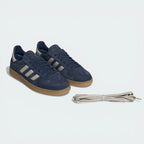 Emphasizing the T-toe overlay and the sophisticated navy-on-navy colour blocking.