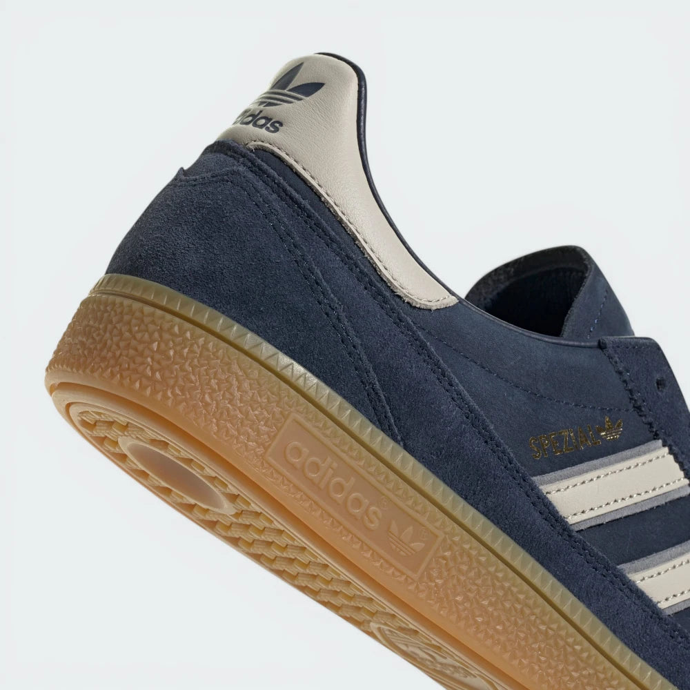 Highlighting the textured nature of the rubber and the high-quality gold foil detailing.