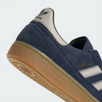 Highlighting the textured nature of the rubber and the high-quality gold foil detailing.