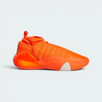 Highlights the high-velocity sweep of the quilted orange textile stitches, showing the professional integration of the matte Wonder White heel capsule and the low-slung black midsole wall.